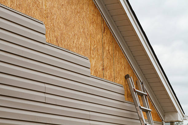 Professional Siding Contractor technician working in Highland, IL